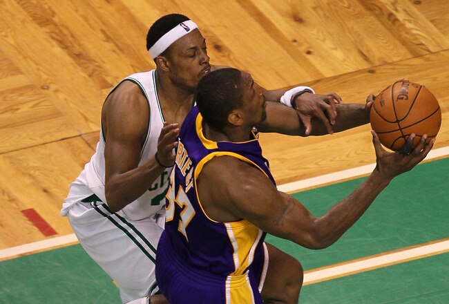 BOSTON - JUNE 13:  Ron Artest #37 of the Los Angeles Lakers goes to the basket against Paul Pierce #34 of the Boston Celtics during Game Five of the 2010 NBA Finals on June 13, 2010 at TD Garden in Boston, Massachusetts. The Celtics won 92-86. NOTE TO USER: User expressly acknowledges and agrees that, by downloading and/or using this Photograph, user is consenting to the terms and conditions of the Getty Images License Agreement.  (Photo by Jim Rogash/Getty Images)