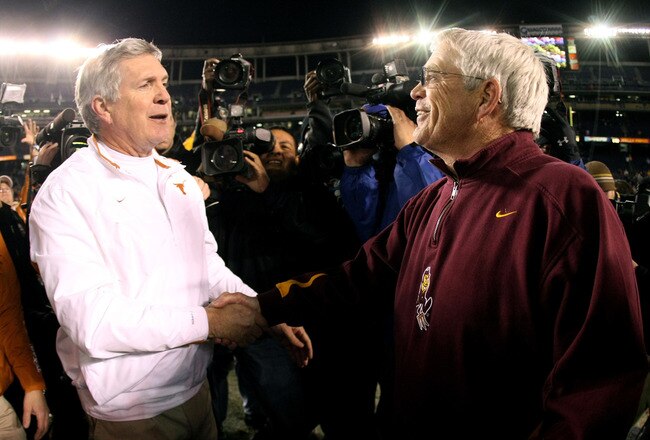 SAN DIEGO - DECEMBER 27:  Head Coaches Mack Brown (L) of the Texas Longhorns and Dennis Erickson of the Arizona State Sun Devils shake hands midfield after the Texas Longhorns beat the Arizona State Sun Devils 52-34 during the Pacific Life Holiday Bowl on December 27, 2007 at Qualcomm Stadium in San Diego, California. (Photo by Donald Miralle/Getty Images)
