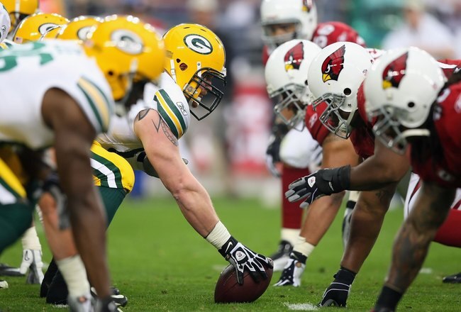 GLENDALE, AZ - JANUARY 10:  Center Scott Wells #63 of the Green Bay Packers prepares to snap the ball during the 2010 NFC wild-card playoff game against the Arizona Cardinals at the Universtity of Phoenix Stadium on January 10, 2010 in Glendale, Arizona.  The Cardinals defeated the Packers  51-45 in overtime.  (Photo by Christian Petersen/Getty Images)