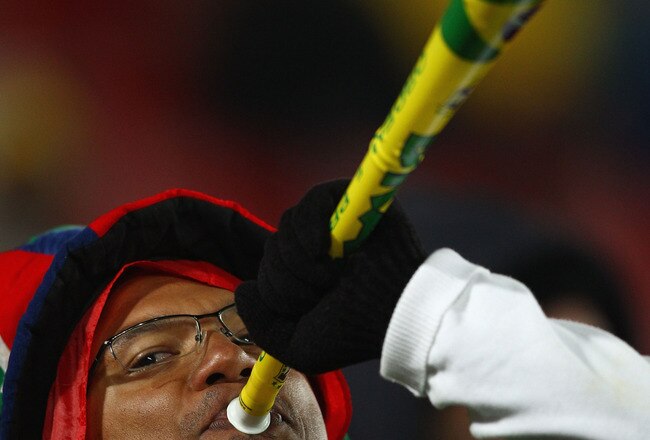 JOHANNESBURG, SOUTH AFRICA - JUNE 15:  A Brazil fan blows a vuvuzela prior to the 2010 FIFA World Cup South Africa Group G match between Brazil and North Korea at Ellis Park Stadium on June 15, 2010 in Johannesburg, South Africa.  (Photo by Richard Heathcote/Getty Images)