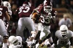 COLLEGE STATION, TX - NOVEMBER 26: Tailback Christine Michael #33 of the Texas A&M Aggies rushes for a gain against the Texas Longhorns defense in the second half at Kyle Field on November 26, 2009 in College Station, Texas. The Longhorns defeated the Aggies 49-39. (Photo by Aaron M. Sprecher/Getty Images)