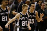 EAST RUTHERFORD, NJ - JUNE 13:  (L-R) Tim Duncan #21, Steve Kerr #25, and Emanuel Ginobili #20 of the San Antonio Spurs celebrate after defeating the New Jersey Nets in Game five of the 2003 NBA Finals at Continental Airlines Arena on June 13, 2003 in East Rutherford, New Jersey.  The Spurs won 93-83.  NOTE TO USER:  User expressly acknowledges and agrees that, by downloading and/or using this Photograph, User is consenting to the terms and conditions of the Getty Images License Agreement.  Mandatory Copyright Notice:  Copyright 2003 NBAE  (Photo by Doug Pensinger/Getty Images)