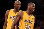 LOS ANGELES, CA - JUNE 15:  Kobe Bryant #24 of the Los Angeles Lakers reacts to getting fouled as teammate Lamar Odom #7 of the Lakers looks on in the fourth quarter of Game Six of the 2010 NBA Finals against the Boston Celtics at Staples Center on June 15, 2010 in Los Angeles, California.  NOTE TO USER: User expressly acknowledges and agrees that, by downloading and/or using this Photograph, user is consenting to the terms and conditions of the Getty Images License Agreement.  (Photo by Christian Petersen/Getty Images)