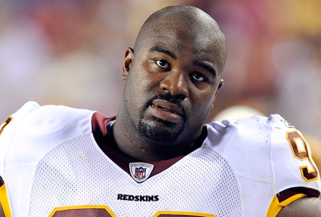 LANDOVER, MD - AUGUST 22:  Albert Haynesworth #92 of the Washington Redskins watches the game against the Pittsburgh Steelers at Fed Ex Field on August 22, 2009 in Landover, Maryland.  (Photo by Greg Fiume/Getty Images)