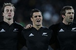NEW PLYMOUTH, NEW ZEALAND - JUNE 12:  (L-R) Jimmy Cowan, Dan Carter and Conrad Smith of the All Blacks sing the National Anthem before the game between the New Zealand All Blacks and Ireland at Yarrow Stadium on June 12, 2010 in New Plymouth, New Zealand.  (Photo by Phil Walter/Getty Images)