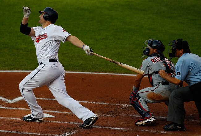 CLEVELAND - JUNE 11:  Austin Kearns #26 of the Cleveland Indians hits a three run home run against the Washington Nationals during the game on June 11, 2010 at Progressive Field in Cleveland, Ohio.  (Photo by Jared Wickerham/Getty Images)
