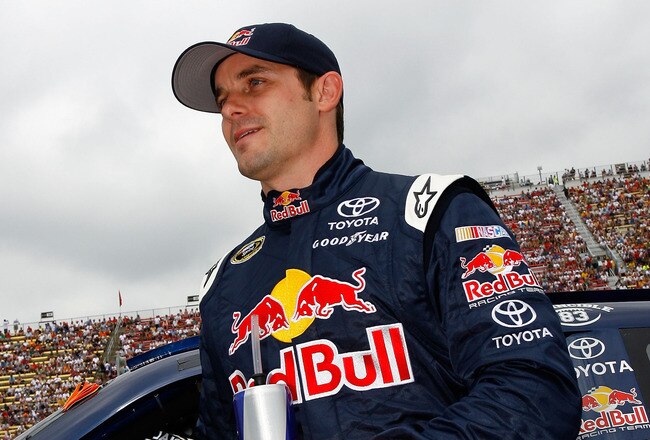 BROOKLYN, MI - JUNE 13:  Casey Mears stands by the #83 Red Bull Toyota prior to the start of the NASCAR Sprint Cup Series Heluva Good! Sour Cream Dips 400 at Michigan International Speedway on June 13, 2010 in Brooklyn, Michigan.  (Photo by Jason Smith/Getty Images for NASCAR)