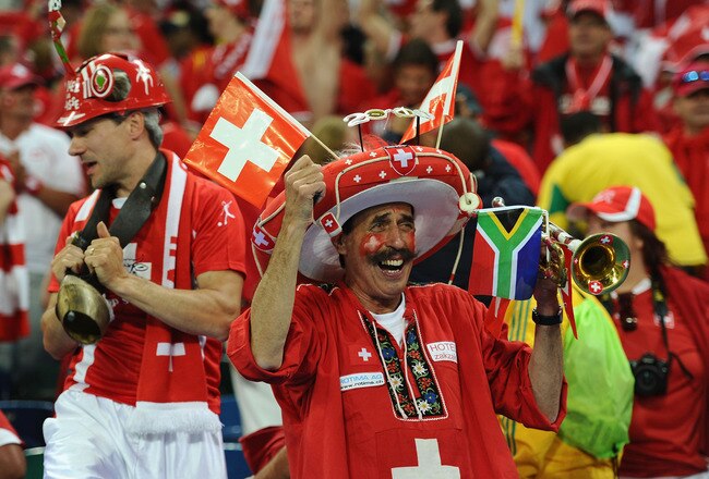 DURBAN, SOUTH AFRICA - JUNE 16:  Switzerland fans celebrate victory in the 2010 FIFA World Cup South Africa Group H match between Spain and Switzerland at Durban Stadium on June 16, 2010 in Durban, South Africa.  (Photo by Laurence Griffiths/Getty Images)