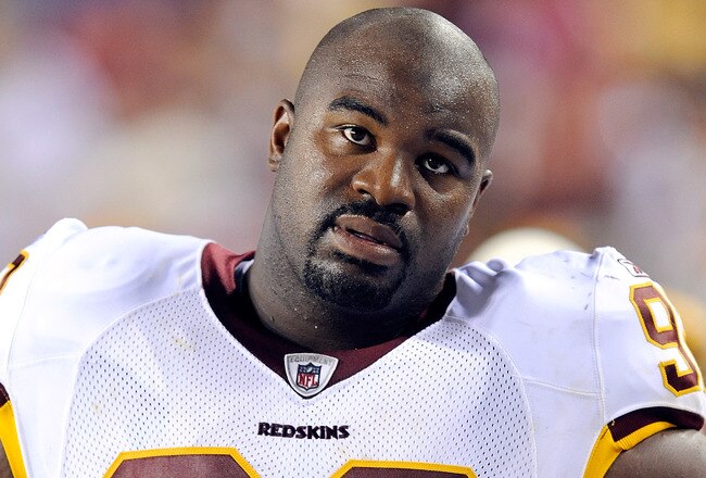 LANDOVER, MD - AUGUST 22:  Albert Haynesworth #92 of the Washington Redskins watches the game against the Pittsburgh Steelers at Fed Ex Field on August 22, 2009 in Landover, Maryland.  (Photo by Greg Fiume/Getty Images)