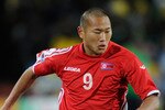 JOHANNESBURG, SOUTH AFRICA - JUNE 15: Jong Tae-Se of North Korea in action during the 2010 FIFA World Cup South Africa Group G match between Brazil and North Korea at Ellis Park Stadium on June 15, 2010 in Johannesburg, South Africa.  (Photo by Stuart Franklin/Getty Images)