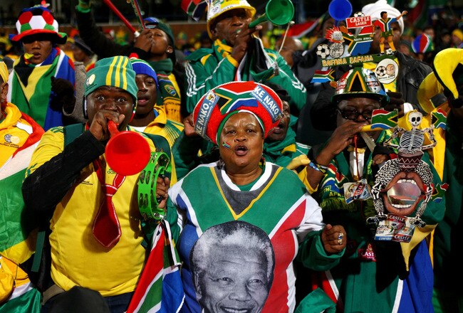 PRETORIA, SOUTH AFRICA - JUNE 16:  South Africa fans blow a vuvuzela and enjoy the atmosphere ahead of the 2010 FIFA World Cup South Africa Group A match between South Africa and Uruguay at Loftus Versfeld Stadium on June 16, 2010 in Tshwane/Pretoria, South Africa.  (Photo by Michael Steele/Getty Images)