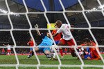 DURBAN, SOUTH AFRICA - JUNE 16:  Gelson Fernandes of Switzerland scores the first goal under pressure from Iker Casillas and Gerard Pique of Spain during the 2010 FIFA World Cup South Africa Group H match between Spain and Switzerland at Durban Stadium on June 16, 2010 in Durban, South Africa.  (Photo by Laurence Griffiths/Getty Images)