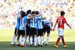 JOHANNESBURG, SOUTH AFRICA - JUNE 17:  Lee Chung-Yong of South Korea walks past Argentina players celebrating an own goal by Park Chu-Young during the 2010 FIFA World Cup South Africa Group B match between Argentina and South Korea at Soccer City Stadium on June 17, 2010 in Johannesburg, South Africa.  (Photo by Chris McGrath/Getty Images)