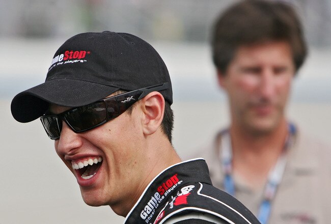 DOVER, DE - MAY 31: Joey Logano driver of the #20 GameStop Toyota laughs while his father Tom looks on during the NASCAR Nationwide Series Heluva Good! 200 at Dover International Speedway on May 31, 2008 in Dover, Delaware.  (Photo by Drew Hallowell/Getty Images for NASCAR)