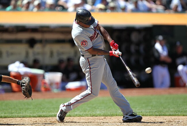 OAKLAND, CA - JUNE 06:  Delmon Young #21 of the Minnesota Twins hits a two run home run in the eighth inning against the Oakland Athletics during an MLB game at the Oakland-Alameda County Coliseum on June 6, 2010 in Oakland, California.  (Photo by Jed Jacobsohn/Getty Images)
