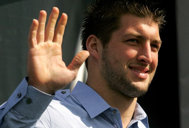 DAYTONA BEACH, FL - FEBRUARY 11:  Quaterback Tim Tebow #7 of the Florida Gators stands onstage before the first NASCAR Sprint Cup Series Gatorade Duel at Daytona International Speedway on February 11, 2010 in Daytona Beach, Florida.  (Photo by Jerry Markland/Getty Images for NASCAR)