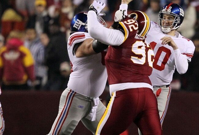 LANDOVER, MD - DECEMBER 21:  Quarterback Eli Manning #10 of the New York Giants passes the ball in the first quarter against the Washington Redskins at FedEx Field on December 21, 2009 in Landover, Maryland. (Photo by Al Bello/Getty Images)