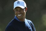 PEBBLE BEACH, CA - JUNE 16:  Tiger Woods smiles as he looks on during a practice round prior to the start of the 110th U.S. Open at Pebble Beach Golf Links on June 16, 2010 in Pebble Beach, California.  (Photo by Donald Miralle/Getty Images)