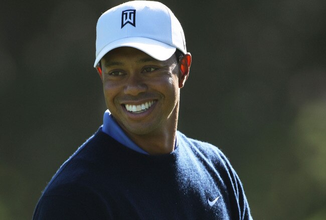 PEBBLE BEACH, CA - JUNE 16:  Tiger Woods smiles as he looks on during a practice round prior to the start of the 110th U.S. Open at Pebble Beach Golf Links on June 16, 2010 in Pebble Beach, California.  (Photo by Donald Miralle/Getty Images)