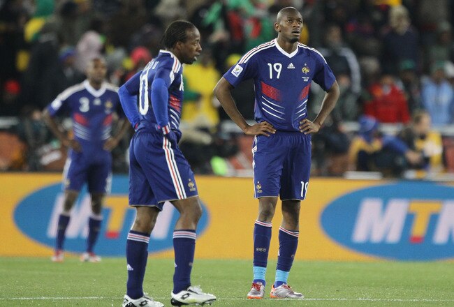 POLOKWANE, SOUTH AFRICA - JUNE 17: Abou Diaby and Sidney Govou of France look dejected following the first goal by Javier Hernandez of Mexico during the 2010 FIFA World Cup South Africa Group A match between France and Mexico at the Peter Mokaba Stadium on June 17, 2010 in Polokwane, South Africa.  (Photo by Ezra Shaw/Getty Images)