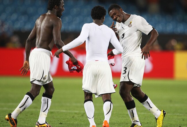 PRETORIA, SOUTH AFRICA - JUNE 13:  Asamoah Gyan of Ghana (R) dances with teammates Hans Sarpei (L) and Anthony Annan after victory in the 2010 FIFA World Cup South Africa Group D match between Serbia and Ghana at Loftus Versfeld Stadium on June 13, 2010 in Pretoria, South Africa.  (Photo by Phil Cole/Getty Images)