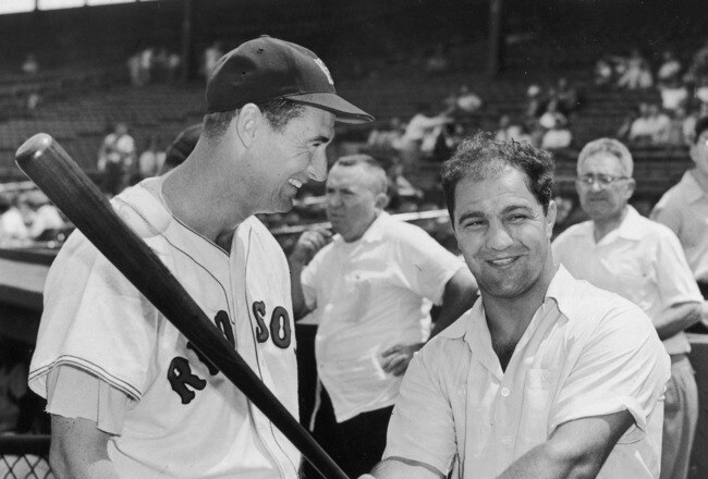 BOSTON - CIRCA 1955:  (UNDATED FILE PHOTO) Baseball legend Ted Williams (1918 - 2002) of the Boston Red Sox (L) laughs as American boxing great Rocky Marciano (1923 - 1969) swings a bat circa 1955. The 83-year-old Williams, who was the last major league player to bat .400 when he hit .406 in 1941, died July 5, 2002 at Citrus County Memorial Hospital in Florida. He died of an apparent heart attack.  (Photo by Getty Images)