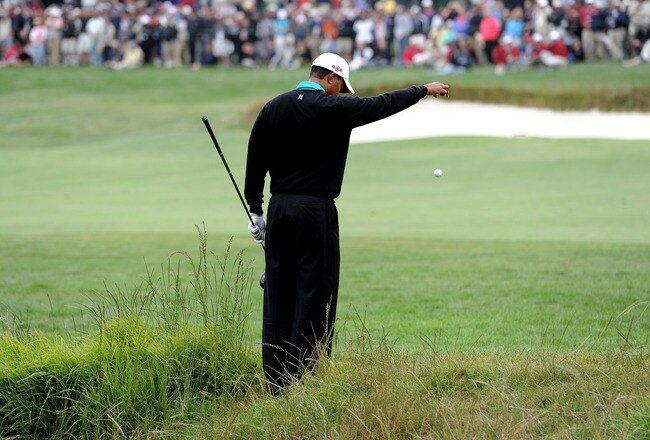 PEBBLE BEACH, CA - JUNE 18:  Tiger Woods takes a drop on the third hole during the second round of the 110th U.S. Open at Pebble Beach Golf Links on June 18, 2010 in Pebble Beach, California.  (Photo by Harry How/Getty Images)