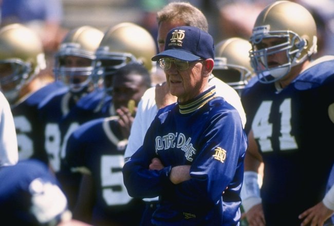 2 Sep 1995: Head coach Lou Holtz of the Notre Dame Fighting Irish stands on the field as he looks on during team pre game warmups before the Irish's 17-15 loss to the Northwestern Wildcats at Notre Dame Stadium in South Bend, Indiana.