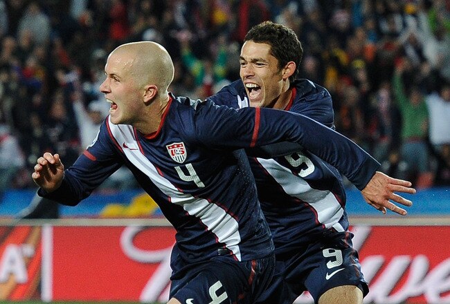JOHANNESBURG, SOUTH AFRICA - JUNE 18:  Michael Bradley of the United States celebrates scoring his team's second goal with team mate Herculez Gomez during the 2010 FIFA World Cup South Africa Group C match between Slovenia and USA at Ellis Park Stadium on June 18, 2010 in Johannesburg, South Africa.  (Photo by Kevork Djansezian/Getty Images)