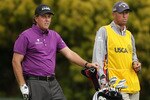 PEBBLE BEACH, CA - JUNE 18:  (L-R) Phil Mickelson and caddie Jim Mackay look on from the 12th tee during the second round of the 110th U.S. Open at Pebble Beach Golf Links on June 18, 2010 in Pebble Beach, California.  (Photo by Andrew Redington/Getty Images)