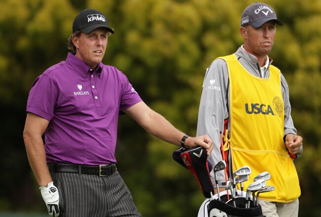 PEBBLE BEACH, CA - JUNE 18:  (L-R) Phil Mickelson and caddie Jim Mackay look on from the 12th tee during the second round of the 110th U.S. Open at Pebble Beach Golf Links on June 18, 2010 in Pebble Beach, California.  (Photo by Andrew Redington/Getty Images)