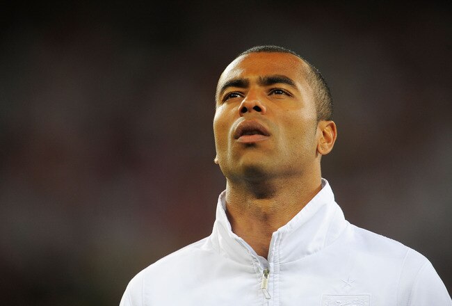 CAPE TOWN, SOUTH AFRICA - JUNE 18:  Ashley Cole of England lines up for the national anthems prior to the 2010 FIFA World Cup South Africa Group C match between England and Algeria at Green Point Stadium on June 18, 2010 in Cape Town, South Africa.  (Photo by Michael Regan/Getty Images)