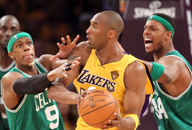 LOS ANGELES, CA - JUNE 17:  Kobe Bryant #24 of the Los Angeles Lakers is double-teammed by Rajon Rondo #9 and Paul Pierce #34 of the Boston Celtics in the third quarter of Game Seven of the 2010 NBA Finals at Staples Center on June 17, 2010 in Los Angeles, California.  NOTE TO USER: User expressly acknowledges and agrees that, by downloading and/or using this Photograph, user is consenting to the terms and conditions of the Getty Images License Agreement.  (Photo by Ronald Martinez/Getty Images)