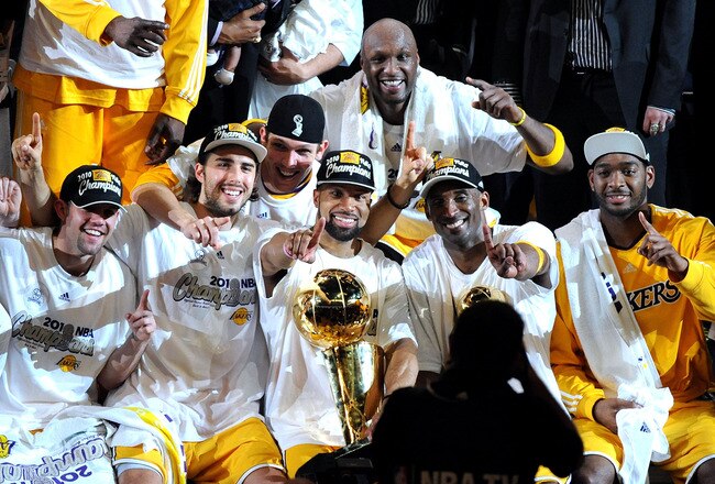 LOS ANGELES, CA - JUNE 17:  Kobe Bryant #24 of the Los Angeles Lakers holds up the Larry O'Brien trophy after the Lakers defeated the Boston Celtics 83-79 in Game Seven of the 2010 NBA Finals at Staples Center on June 17, 2010 in Los Angeles, California.  NOTE TO USER: User expressly acknowledges and agrees that, by downloading and/or using this Photograph, user is consenting to the terms and conditions of the Getty Images License Agreement.  (Photo by Lisa Blumenfeld/Getty Images)