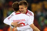 PRETORIA, SOUTH AFRICA - JUNE 19:  Dennis Rommedahl of Denmark celebrates with Nicklas Bendtner after he scores his team's second goal during the 2010 FIFA World Cup South Africa Group E match between Cameroon and Denmark at Loftus Versfeld Stadium on June 19, 2010 in Tshwane/Pretoria, South Africa.  (Photo by Michael Steele/Getty Images)