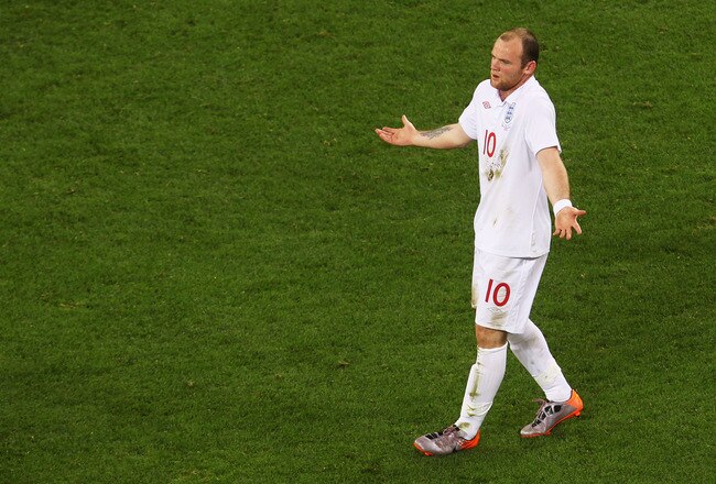 CAPE TOWN, SOUTH AFRICA - JUNE 18:  Wayne Rooney of England shows his frustration during the 2010 FIFA World Cup South Africa Group C match between England and Algeria at Green Point Stadium on June 18, 2010 in Cape Town, South Africa.  (Photo by Lars Baron/Getty Images)