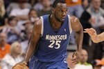 PHOENIX - MARCH 16:  Al Jefferson #25 of the Minnesota Timberwolves handles the ball during the NBA game against the Phoenix Suns at US Airways Center on March 16, 2010 in Phoenix, Arizona. The Suns defeated the Timberwolves 152-114.  NOTE TO USER: User expressly acknowledges and agrees that, by downloading and or using this photograph, User is consenting to the terms and conditions of the Getty Images License Agreement.  (Photo by Christian Petersen/Getty Images)