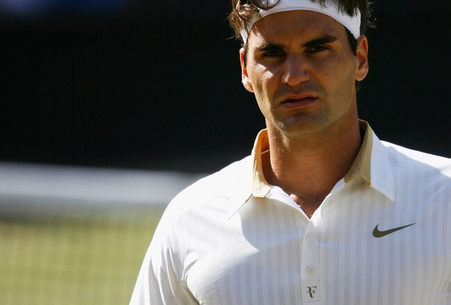 WIMBLEDON, ENGLAND - JULY 05:  Roger Federer of Switzerland looks on during the men's singles final match against Andy Roddick of USA on Day Thirteen of the Wimbledon Lawn Tennis Championships at the All England Lawn Tennis and Croquet Club on July 5, 2009 in London, England.  (Photo by Paul Gilham/Getty Images)