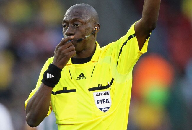 JOHANNESBURG, SOUTH AFRICA - JUNE 18:  Referee Koman Coulibaly makes a decision during the 2010 FIFA World Cup South Africa Group C match between Slovenia and USA at Ellis Park Stadium on June 18, 2010 in Johannesburg, South Africa.  (Photo by Ezra Shaw/Getty Images)