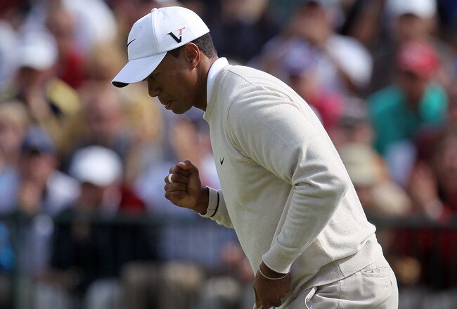 PEBBLE BEACH, CA - JUNE 19:  Tiger Woods  celebrates a birdie putt on the 13th green during the third round of the 110th U.S. Open at Pebble Beach Golf Links on June 19, 2010 in Pebble Beach, California.  (Photo by Stephen Dunn/Getty Images)
