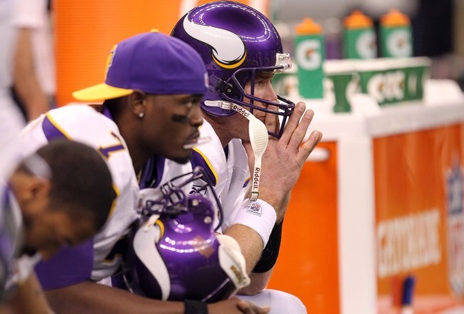 NEW ORLEANS - JANUARY 24:  Brett Favre #4 (C) and Tavaris Jackson #7 of the Minnesota Vikings look on dejected from the bench late in the game against the New Orleans Saints during the NFC Championship Game at the Louisiana Superdome on January 24, 2010 in New Orleans, Louisiana.  (Photo by Ronald Martinez/Getty Images)