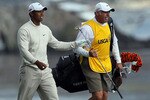 PEBBLE BEACH, CA - JUNE 19:  Tiger Woods walks with his caddie Steve Williams after hitting his approach shot on the 18th hole during the third round of the 110th U.S. Open at Pebble Beach Golf Links on June 19, 2010 in Pebble Beach, California.  (Photo by Stephen Dunn/Getty Images)