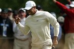 PEBBLE BEACH, CA - JUNE 19:  Tiger Woods  celebrates a birdie putt on the 16th green during the third round of the 110th U.S. Open at Pebble Beach Golf Links on June 19, 2010 in Pebble Beach, California.  (Photo by Stephen Dunn/Getty Images)