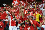 DURBAN, SOUTH AFRICA - JUNE 16:  Switzerland fans celebrate victory in the 2010 FIFA World Cup South Africa Group H match between Spain and Switzerland at Durban Stadium on June 16, 2010 in Durban, South Africa.  (Photo by Laurence Griffiths/Getty Images)