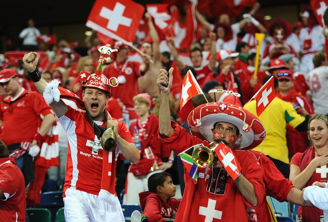 DURBAN, SOUTH AFRICA - JUNE 16:  Switzerland fans celebrate victory in the 2010 FIFA World Cup South Africa Group H match between Spain and Switzerland at Durban Stadium on June 16, 2010 in Durban, South Africa.  (Photo by Laurence Griffiths/Getty Images)