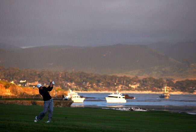 PEBBLE BEACH, CA - JUNE 19:  Dustin Johnson watches his second shot on the 18th hole during the third round of the 110th U.S. Open at Pebble Beach Golf Links on June 19, 2010 in Pebble Beach, California.  (Photo by Donald Miralle/Getty Images)