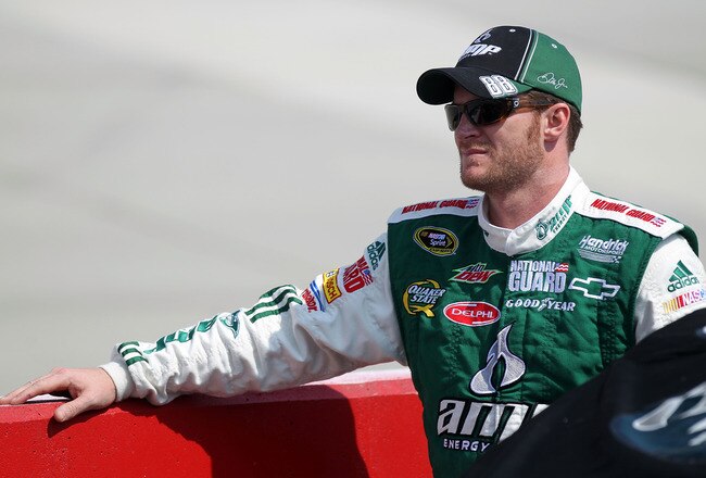 DOVER, DE - MAY 14:  Dale Earnhardt Jr., driver of the #88 AMP Energy/National Guard Chevrolet, stands on the grid during qualifying for the NASCAR Sprint Cup Series Autism Speaks 400 at Dover International Speedway on May 14, 2010 in Dover, Delaware.  (Photo by Nick Laham/Getty Images)