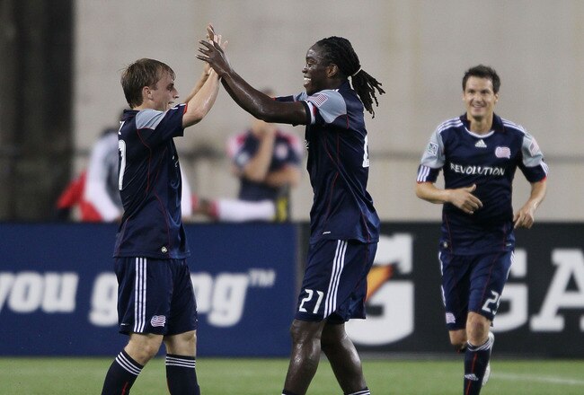 FOXBORO, MA - MAY 29:  Zach Schilawski #15 of the New England Revolution celebrates with Shalrie Joseph #21 as Marko Perovic #29 joins them after a goal in the first half against the New York Red Bulls on May 29, 2010 at Gillette Stadium in Foxboro, Massachusetts.  (Photo by Elsa/Getty Images)