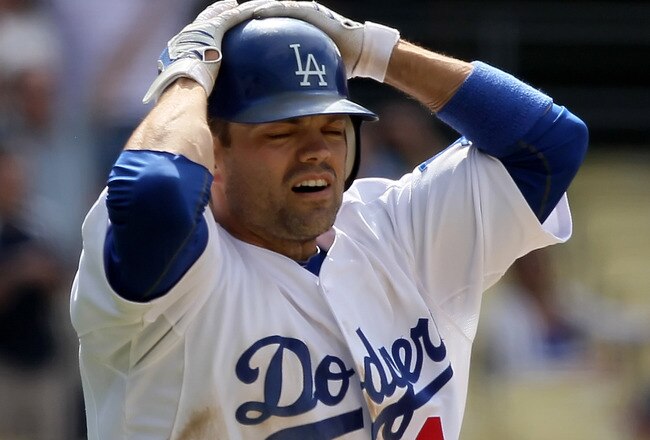 LOS ANGELES, CA - JUNE 02:  Jamey Carroll #14 of the Los Angeles Dodgers reacts after hitting a foul ball that would have driven home the game winning run in the 13th inning against the Arizona Diamondbacks at Dodger Stadium on June 2, 2010 in Los Angeles, California.  The Dodgers defeated the Diamondbacks 1-0 in 14 innings.  (Photo by Jeff Gross/Getty Images)
