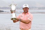 PEBBLE BEACH, CA - JUNE 20:  Graeme McDowell (R) of Northern Ireland celebrates with the trophy on the 18th green after winning the 110th U.S. Open at Pebble Beach Golf Links on June 20, 2010 in Pebble Beach, California.  (Photo by Ross Kinnaird/Getty Images)